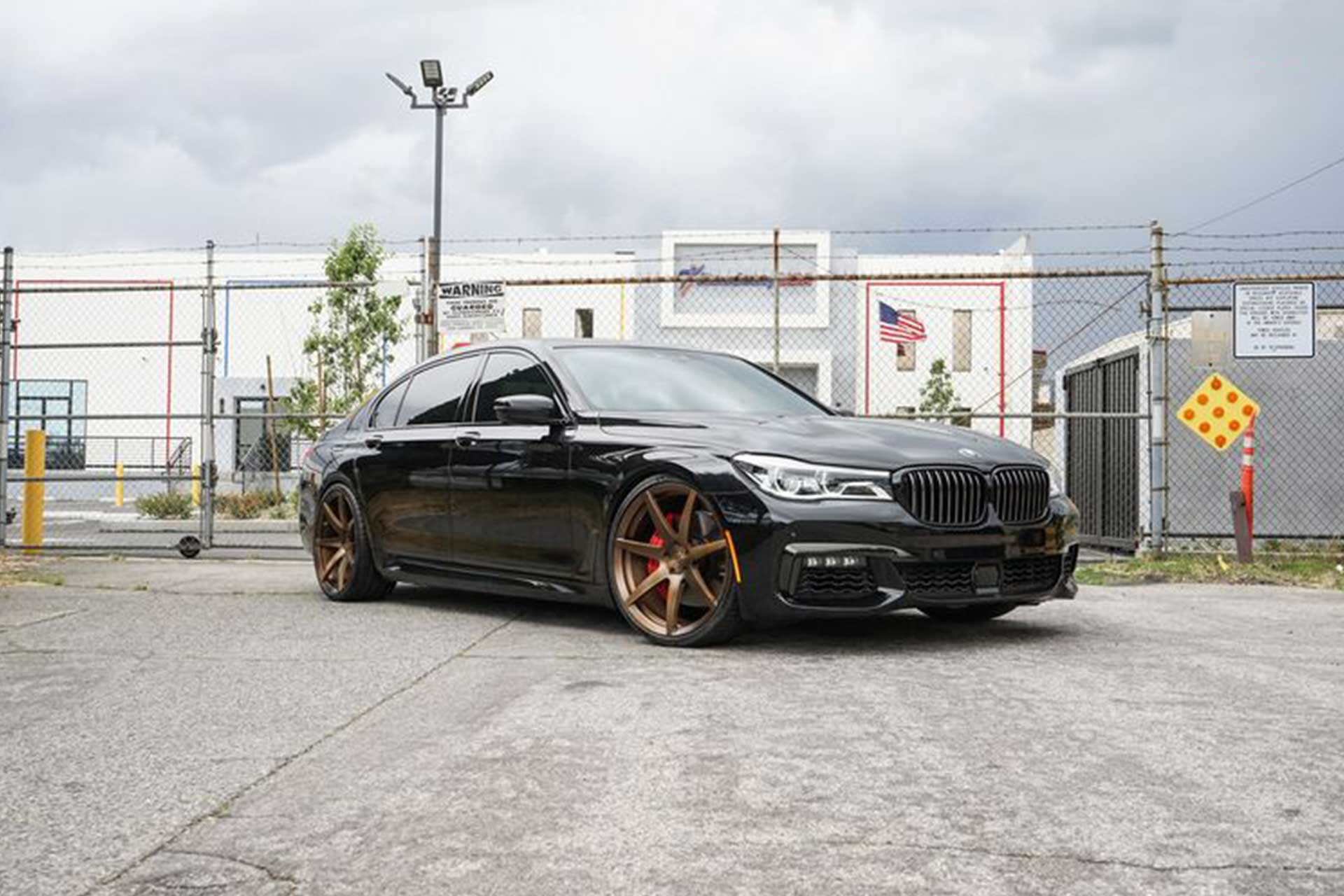 black bmw 750i with satin brushed bronze project 6gr seven wheels