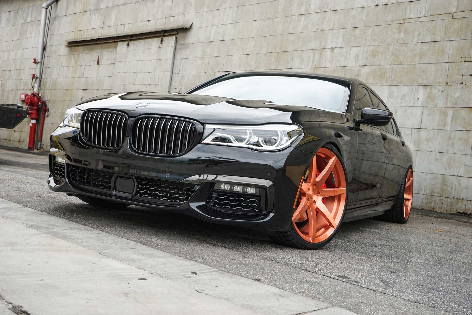 black bmw 750i with brushed candy copper project 6gr seven wheels