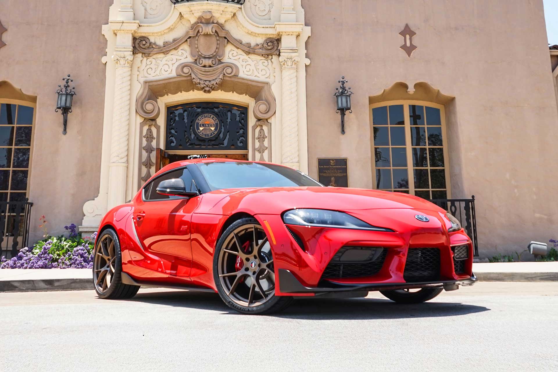 red toyota gr supra with satin bronze project 6gr ten wheels