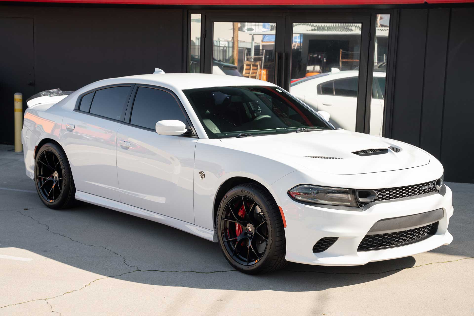 white dodge charger srt hellcat with project 6gr ten wheels